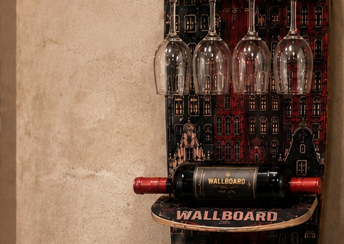 Detail of the wine glasses hanging from the rail and a bottle cradled beneath, on the installed Wallboard.